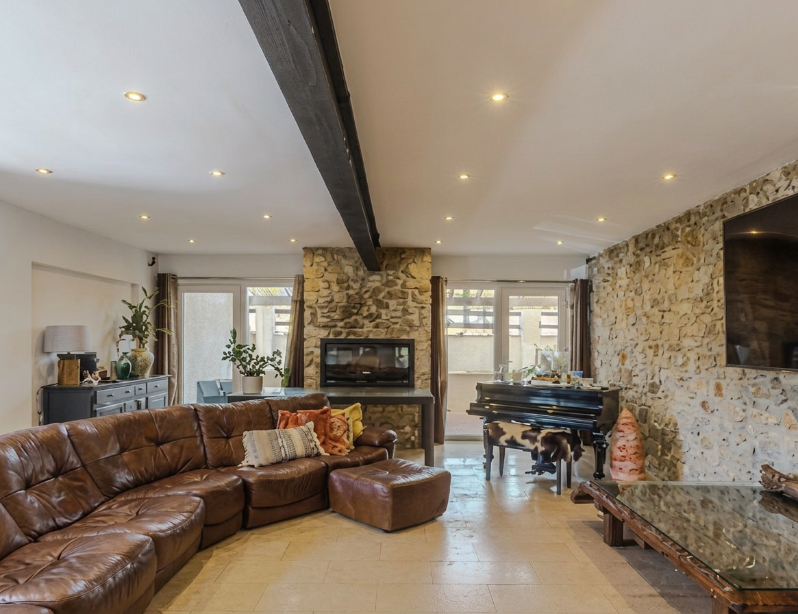 Lounge with natural stone fireplace and piano