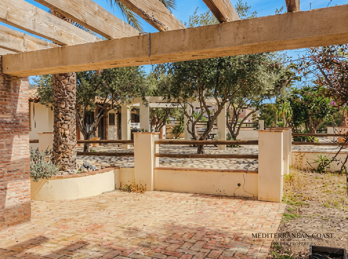 Shaded brick pergola with olive trees