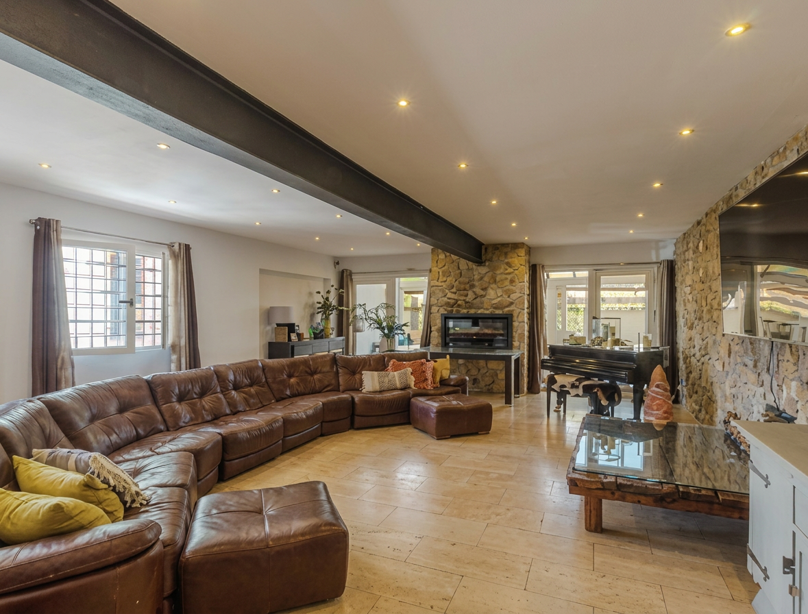 Living room with fireplace, piano and generous seating