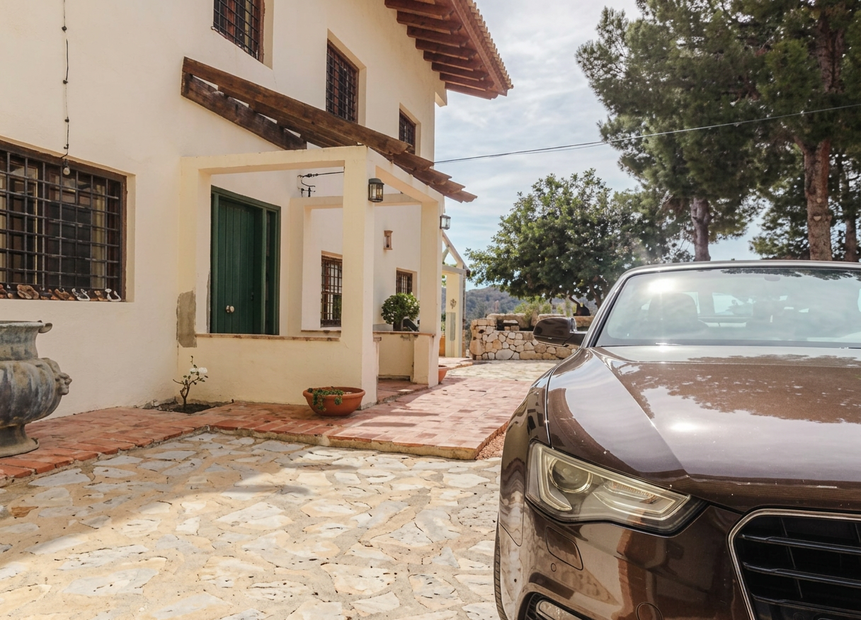 Entrance with courtyard and parking
